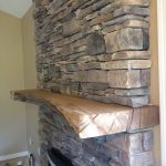 Fireplace Stone Veneer and Wood Mantel